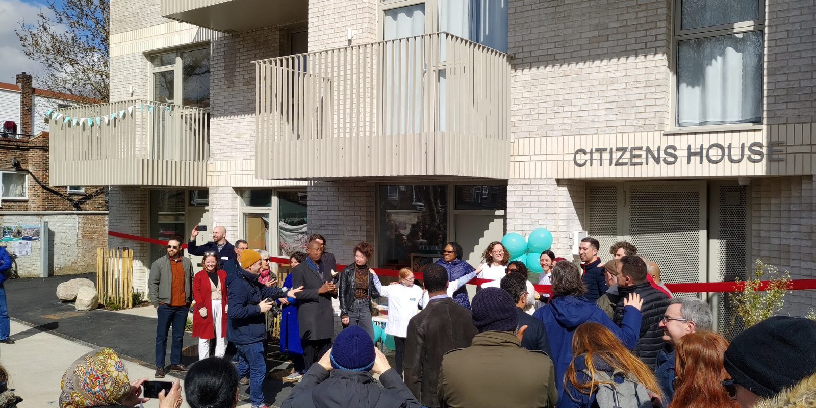 Residents and neighbours celebrating the opening of Citizens House in Lewisham.