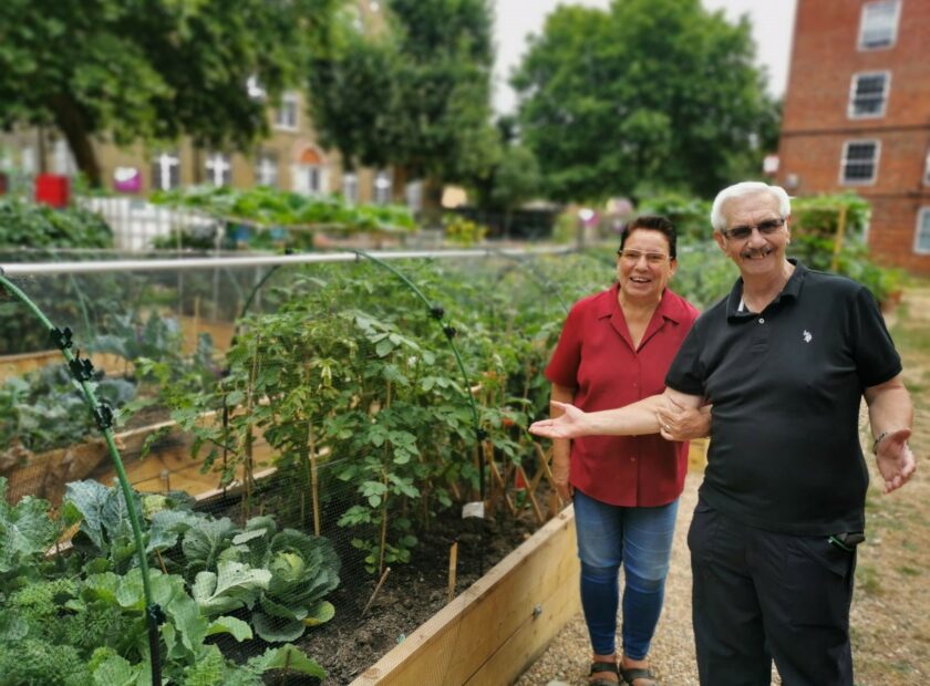 Cover Image. A man and a women in a community garden in Southwark.